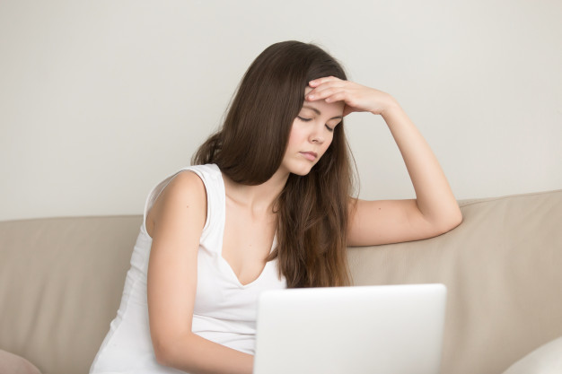 lady-suffering-from-headache-after-work-laptop_1163-4732