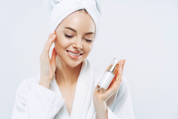 cropped-image-beautiful-charming-woman-touches-her-smooth-skin-gently-uses-cosmetic-product-body-care-applies-moisturizer-after-taking-bath-natural-cosmetology-face-treatment-concept_95891-3302